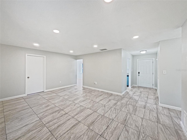 2607 Castle Oak Ave, Orlando, FL 32808 - unfurnished room featuring baseboards and recessed lighting