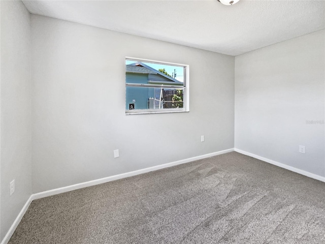 2607 Castle Oak Ave, Orlando, FL 32808 - carpeted empty room featuring baseboards