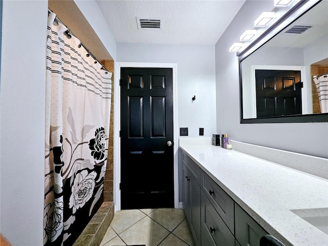 2010 Appian Ct, Deltona, FL 32725 - full bathroom featuring vanity, tile patterned floors, a shower with curtain, and a textured ceiling