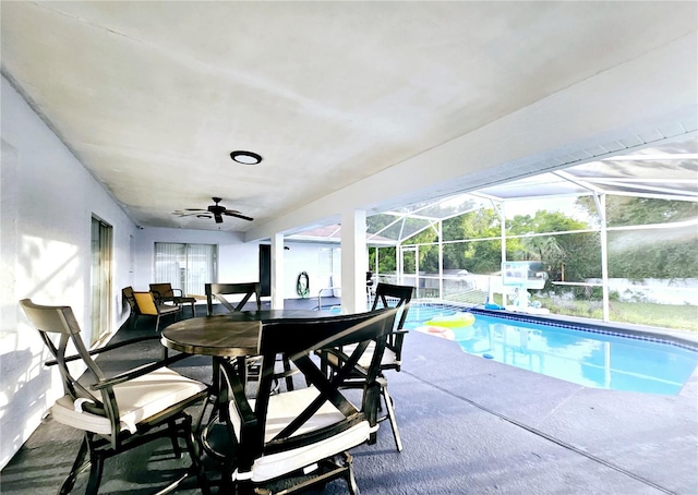 2010 Appian Ct, Deltona, FL 32725 - swimming pool with a ceiling fan, a patio area, glass enclosure, and outdoor dining area
