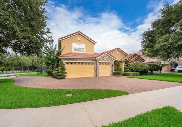 2258 Rickover Pl, Winter Garden, FL 34787 - view of front of house with a tiled roof, decorative driveway, stone siding, and stucco siding