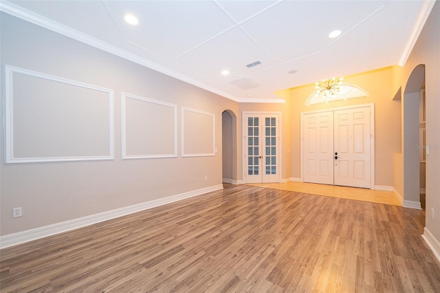 2258 Rickover Pl, Winter Garden, FL 34787 - unfurnished room featuring arched walkways, ornamental molding, light wood-style flooring, french doors, and recessed lighting