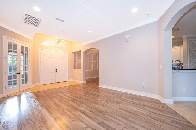 2258 Rickover Pl, Winter Garden, FL 34787 - entrance foyer with crown molding, light wood finished floors, arched walkways, recessed lighting, and a chandelier