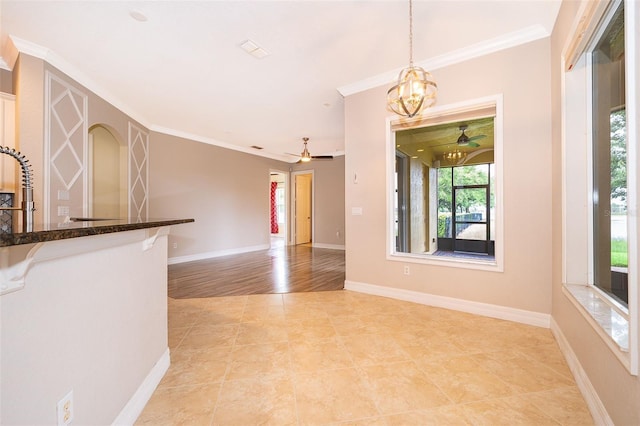 2258 Rickover Pl, Winter Garden, FL 34787 - unfurnished living room with ceiling fan, crown molding, light tile patterned floors, and a chandelier