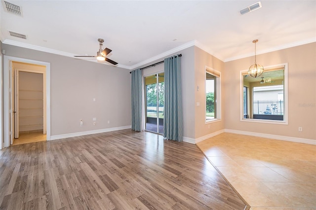 2258 Rickover Pl, Winter Garden, FL 34787 - unfurnished room featuring ornamental molding, a chandelier, ceiling fan, and light wood finished floors