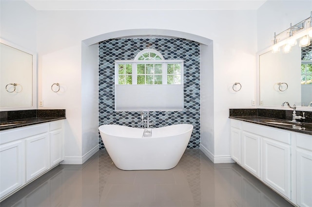 2258 Rickover Pl, Winter Garden, FL 34787 - full bath with vanity, a freestanding tub, plenty of natural light, tile patterned floors, and tile walls