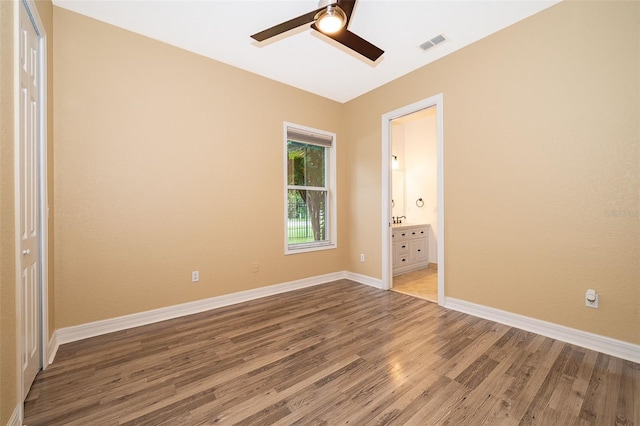 2258 Rickover Pl, Winter Garden, FL 34787 - unfurnished bedroom featuring light wood finished floors, ensuite bathroom, and a ceiling fan