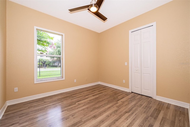 2258 Rickover Pl, Winter Garden, FL 34787 - unfurnished bedroom featuring wood finished floors, a closet, and a ceiling fan