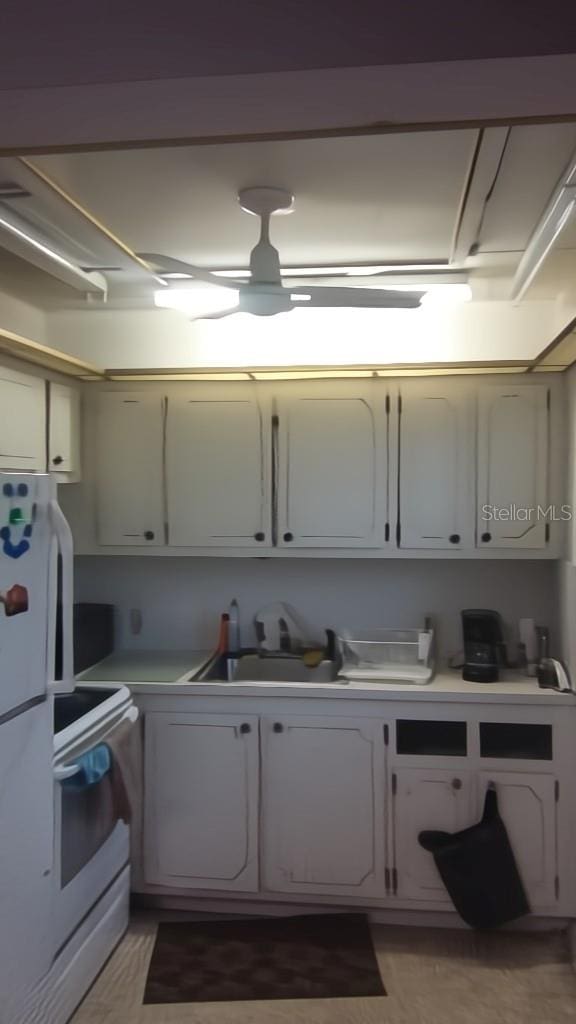 56 Brighton B 56, Boca Raton, FL 33434 - kitchen with light countertops, fridge, and white electric range