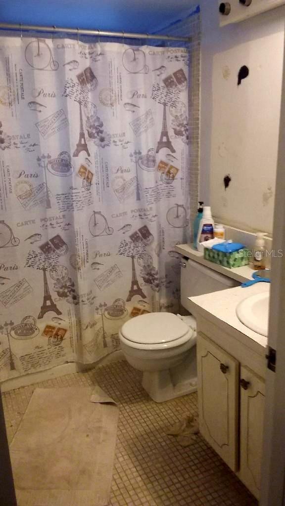 56 Brighton B 56, Boca Raton, FL 33434 - bathroom featuring vanity and a shower with curtain