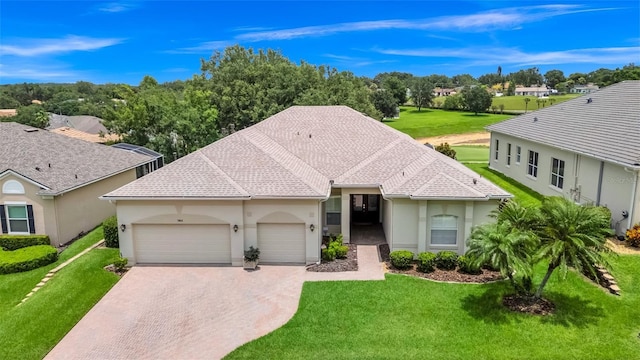 785 Hawks Blf, Clermont, FL 34711 - single story home with a garage, driveway, a front yard, and stucco siding