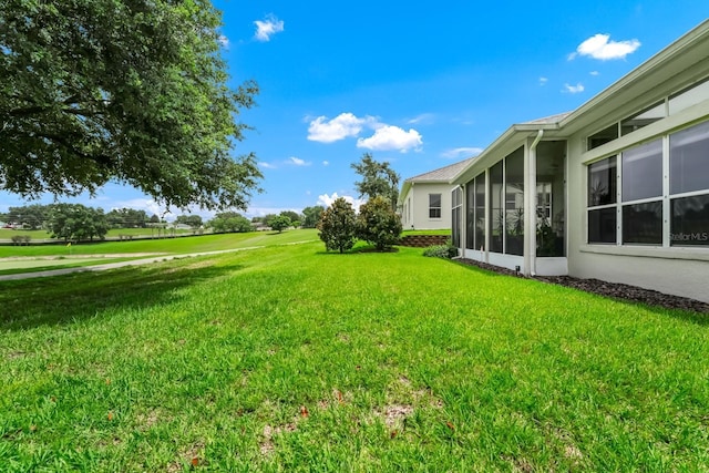 785 Hawks Blf, Clermont, FL 34711 - view of green lawn with a sunroom