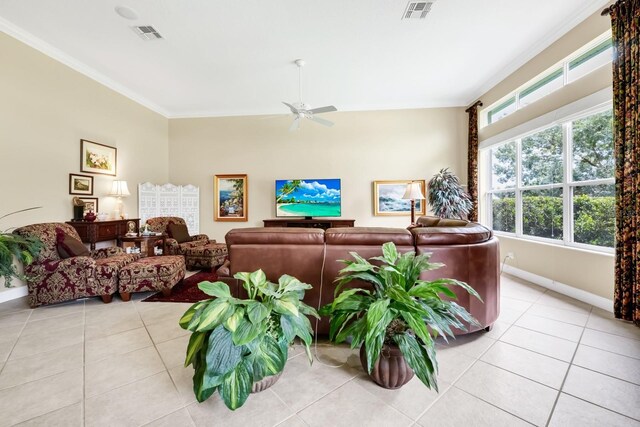 785 Hawks Blf, Clermont, FL 34711 - living area with light tile patterned floors, a ceiling fan, and crown molding