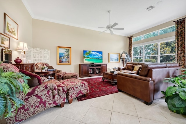 785 Hawks Blf, Clermont, FL 34711 - tiled living room with a ceiling fan and ornamental molding