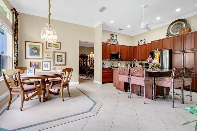 785 Hawks Blf, Clermont, FL 34711 - dining room featuring a chandelier, light tile patterned floors, recessed lighting, ceiling fan, and ornamental molding