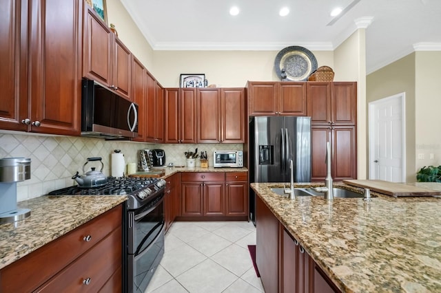 785 Hawks Blf, Clermont, FL 34711 - kitchen with gas range, stainless steel refrigerator with ice dispenser, tasteful backsplash, light stone countertops, and crown molding