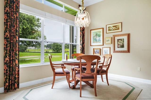 785 Hawks Blf, Clermont, FL 34711 - dining area featuring a chandelier, plenty of natural light, and tile patterned floors
