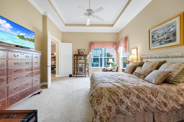 785 Hawks Blf, Clermont, FL 34711 - bedroom featuring light carpet, ornamental molding, a tray ceiling, and ceiling fan