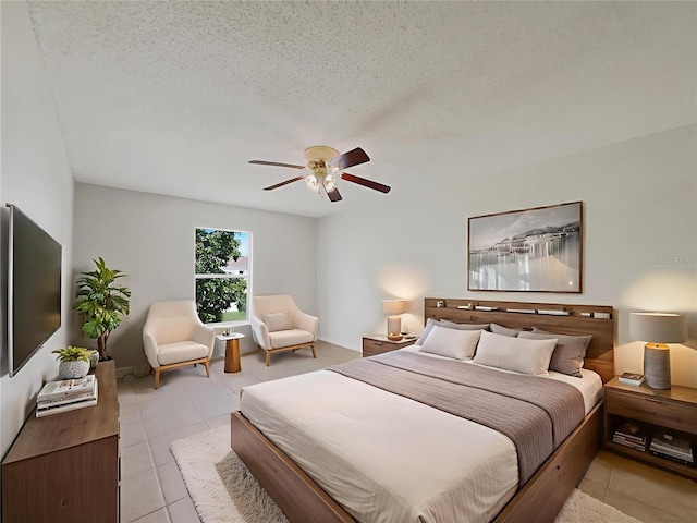 1726 Sunset Ridge Dr, Mascotte, FL 34753 - bedroom with light tile patterned floors, a ceiling fan, and a textured ceiling