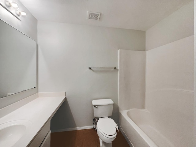 1726 Sunset Ridge Dr, Mascotte, FL 34753 - full bathroom featuring vanity, wood finished floors, and tub / shower combination