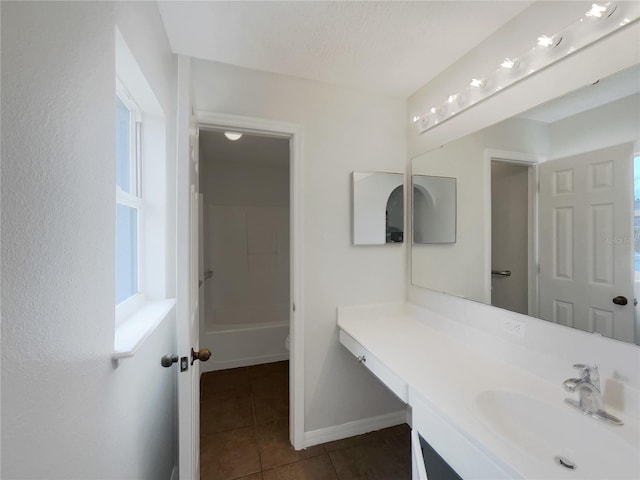 1726 Sunset Ridge Dr, Mascotte, FL 34753 - bathroom featuring vanity, tile patterned flooring, and healthy amount of natural light