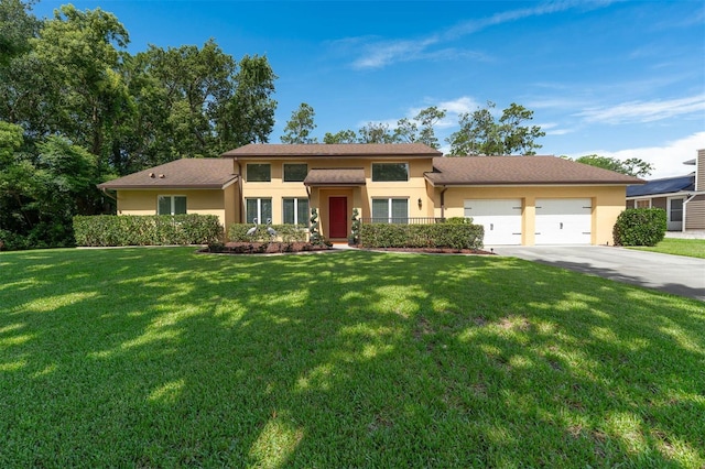 9342 Bay Vista Estates Blvd, Orlando, FL 32836 - view of front of property with stucco siding, an attached garage, concrete driveway, and a front lawn