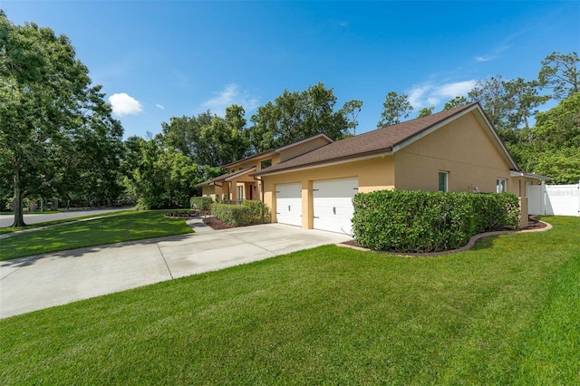 9342 Bay Vista Estates Blvd, Orlando, FL 32836 - view of side of property with an attached garage, driveway, and stucco siding