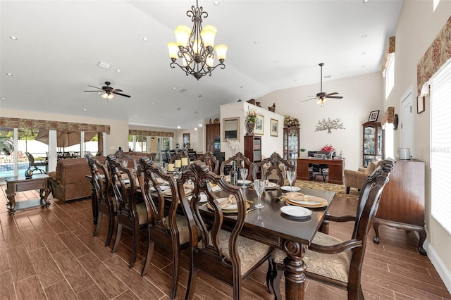 9342 Bay Vista Estates Blvd, Orlando, FL 32836 - dining area featuring a ceiling fan, wood finished floors, and vaulted ceiling