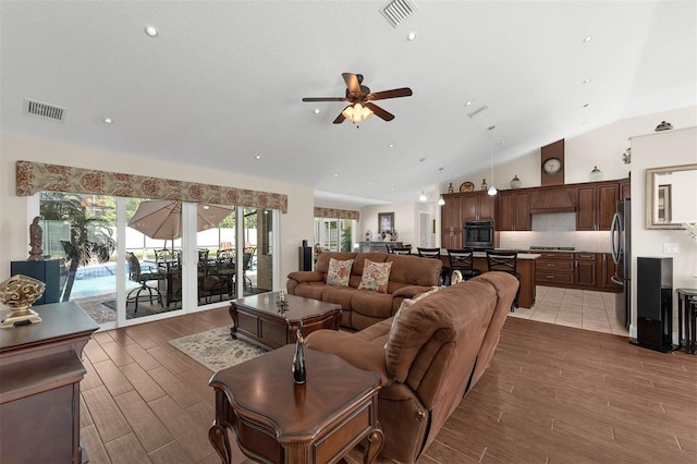 9342 Bay Vista Estates Blvd, Orlando, FL 32836 - living room with ceiling fan, vaulted ceiling, wood finished floors, and recessed lighting