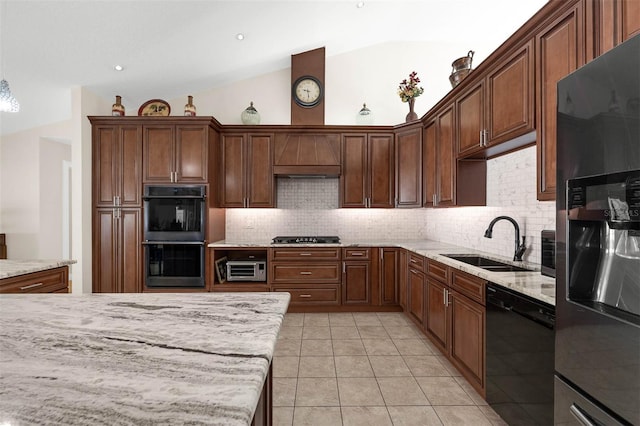 9342 Bay Vista Estates Blvd, Orlando, FL 32836 - kitchen with black appliances, tasteful backsplash, vaulted ceiling, light tile patterned floors, and light stone countertops
