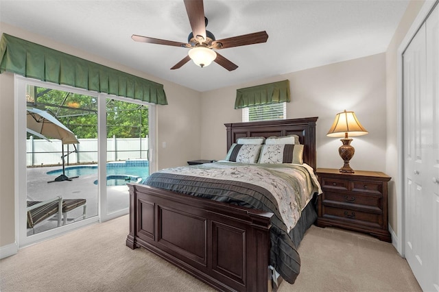 9342 Bay Vista Estates Blvd, Orlando, FL 32836 - bedroom with light colored carpet, access to outside, a closet, and a ceiling fan