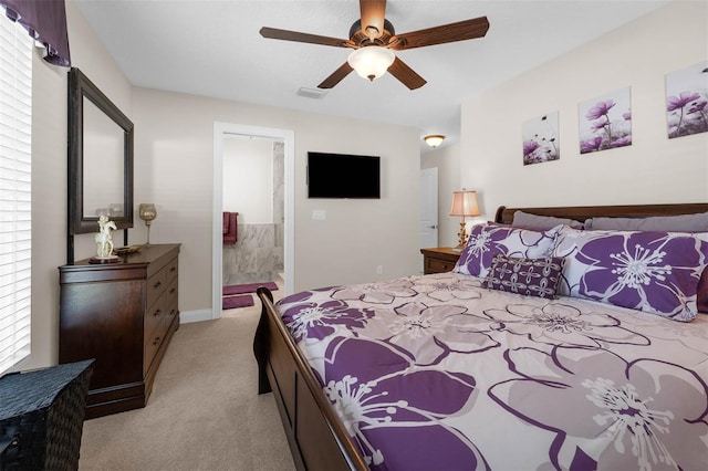 9342 Bay Vista Estates Blvd, Orlando, FL 32836 - bedroom featuring light colored carpet, multiple windows, ensuite bath, and ceiling fan