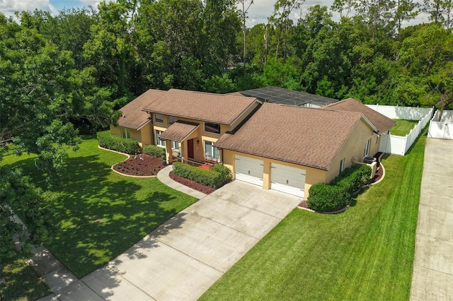 9342 Bay Vista Estates Blvd, Orlando, FL 32836 - view of front of home featuring stucco siding, driveway, a garage, and a shingled roof