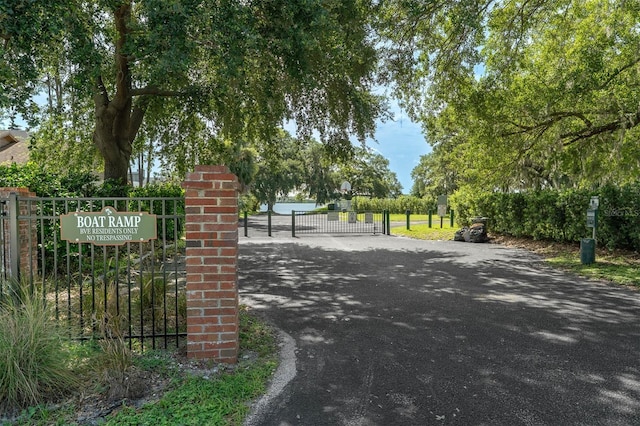 9342 Bay Vista Estates Blvd, Orlando, FL 32836 - view of asphalt driveway featuring a gate