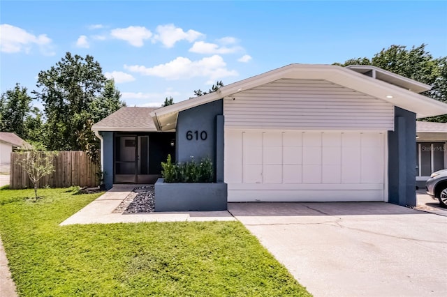 610 Huntly Ln, Winter Springs, FL 32708 - view of front of home with a garage, concrete driveway, and a shingled roof