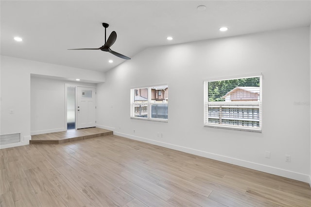 610 Huntly Ln, Winter Springs, FL 32708 - unfurnished living room featuring ceiling fan, vaulted ceiling, light wood finished floors, and recessed lighting