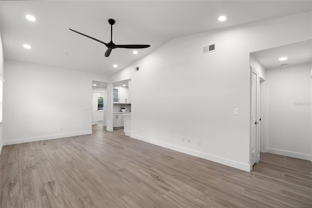 610 Huntly Ln, Winter Springs, FL 32708 - unfurnished living room with ceiling fan, lofted ceiling, light wood-style flooring, and recessed lighting