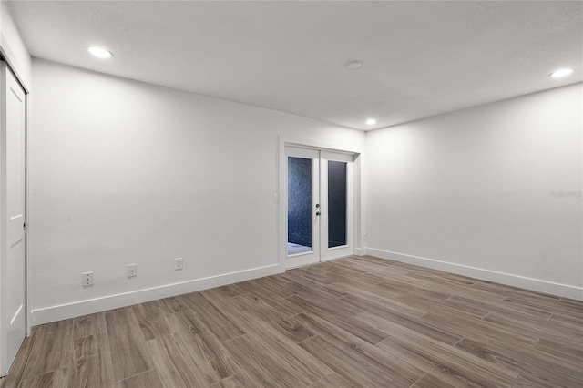 610 Huntly Ln, Winter Springs, FL 32708 - empty room with wood finished floors, french doors, and recessed lighting