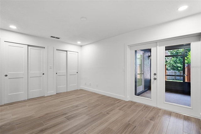 610 Huntly Ln, Winter Springs, FL 32708 - unfurnished bedroom with access to outside, light wood-style flooring, french doors, and recessed lighting