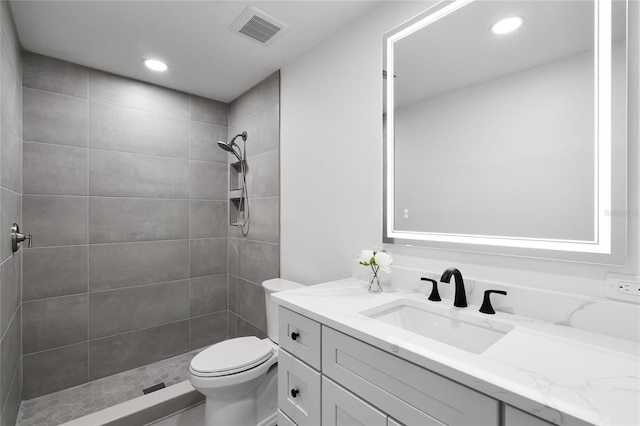 610 Huntly Ln, Winter Springs, FL 32708 - bathroom featuring vanity, tiled shower, and recessed lighting