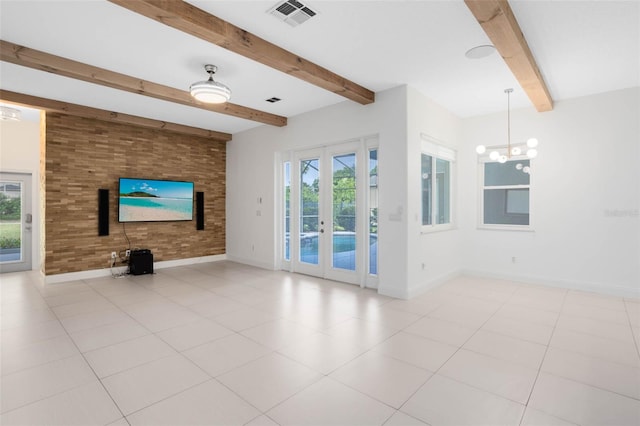 2540 Wembleycross Way, Orlando, FL 32828 - unfurnished living room featuring beam ceiling, french doors, a chandelier, and light tile patterned floors