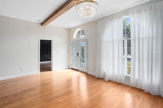 2540 Wembleycross Way, Orlando, FL 32828 - spare room with a chandelier, hardwood / wood-style floors, and beam ceiling