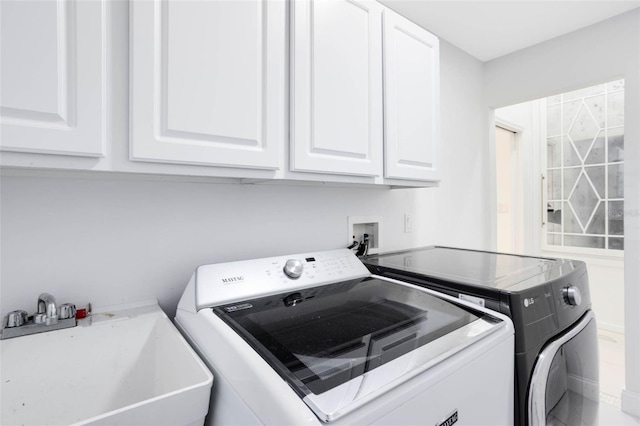 2540 Wembleycross Way, Orlando, FL 32828 - washroom with cabinet space and washer and clothes dryer