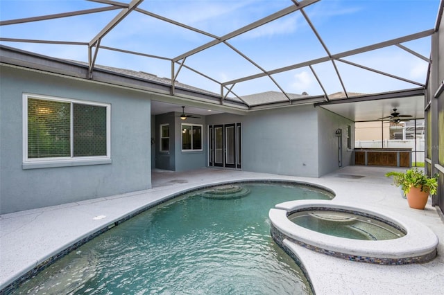 2540 Wembleycross Way, Orlando, FL 32828 - view of swimming pool with ceiling fan, a patio, a pool with connected hot tub, and glass enclosure