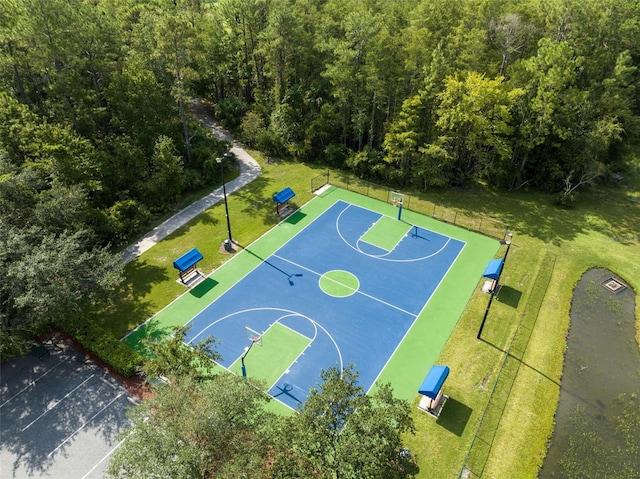 2540 Wembleycross Way, Orlando, FL 32828 - view of sport court with community basketball court and a wooded view