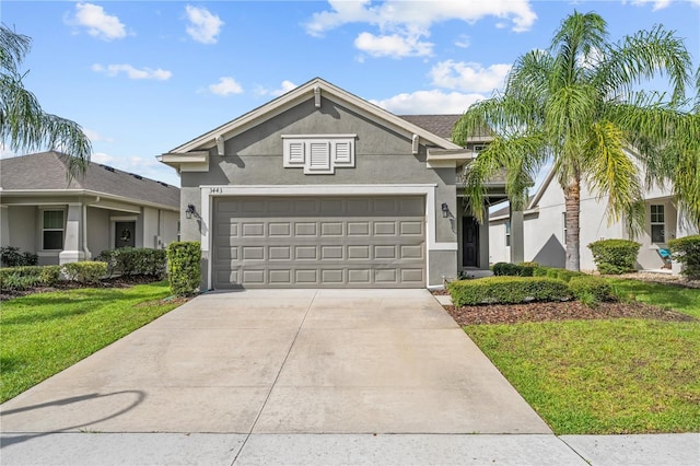 3443 Sagebrush St, Harmony, FL 34773 - view of front of house featuring stucco siding, concrete driveway, a front lawn, and a garage