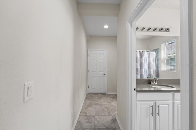 3443 Sagebrush St, Harmony, FL 34773 - hall featuring a sink and baseboards