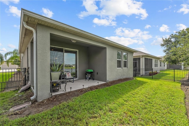 3443 Sagebrush St, Harmony, FL 34773 - rear view of property featuring stucco siding and a patio