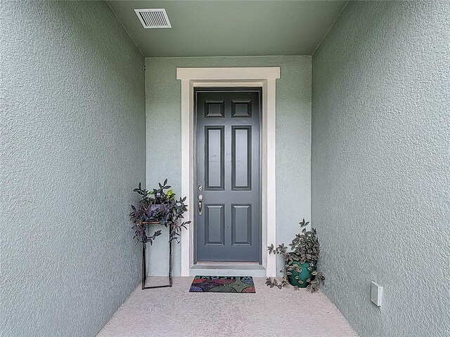 711 Steerview St, Saint Cloud, FL 34771 - view of exterior entry featuring stucco siding