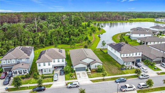 711 Steerview St, Saint Cloud, FL 34771 - aerial perspective of suburban area with a nearby body of water and a heavily wooded area